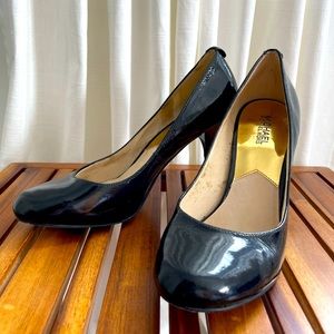 Black leather patent pumps